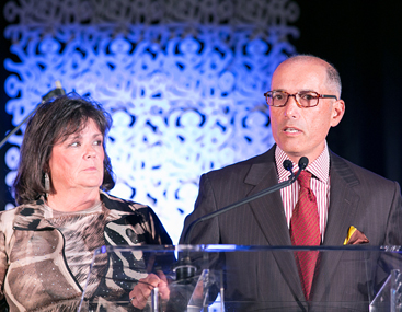 <div>
	<div>
		Peter Pogany (R) and Margaret Zullo (L) accept the Award of Hope for Philanthropic Leadership on behalf of Embrace Kids Foundation.</div>
</div>
<div>
	&nbsp;</div>
