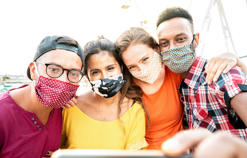 group of diverse teens wearing masks