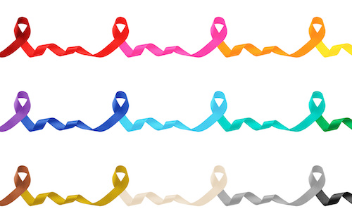 three rows of colorful cancer awareness ribbons all slowly fading from one color to another