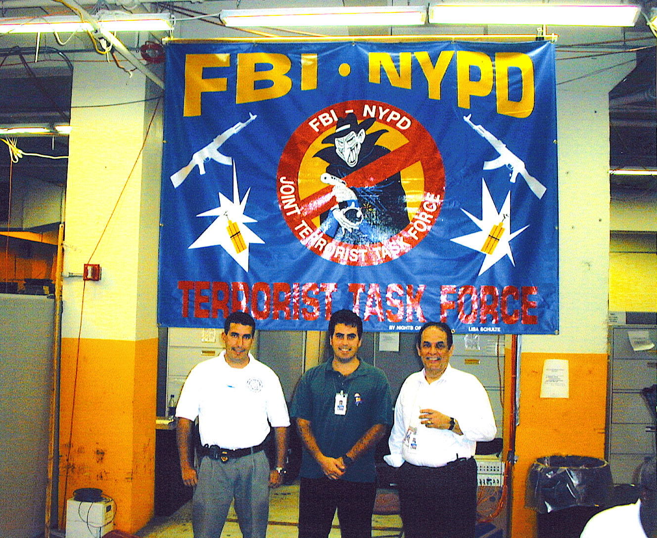 photo of Marcus Rivera at his NYPD headquarters underneath a banner