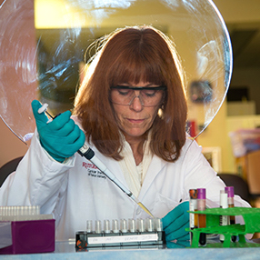 Female researcher working in the lab at Rutgers Cancer Institute