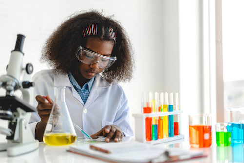 young black girl at science lab bench