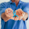 man holding blue awareness ribbon