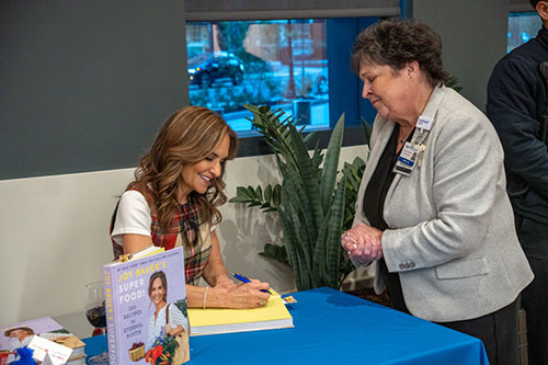 Joy Bauer, Nutrition and Health Expert on NBC’s Today Show signing her latest cookbook for guests at the opening of the State-of-the-art demonstration kitchen at the Jack & Sheryl Morris Cancer Center