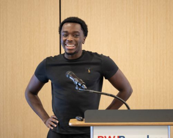 Nathaniel Salako, Gene Therapy recipient, takes the podium to share his experience with sickle cell disease and reflect on what life looks like today following treatment.