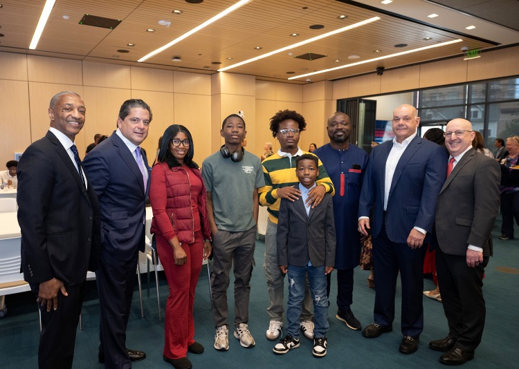 From Left to Right: William F. Tate IV, President, Rutgers, The State University of New Jersey; Mark E. Manigan, President and Chief Executive Officer, RWJBarnabas Health; Pewee Goumou, Bone Marrow Transplant recipient and his brother, Dirus Goumou, donor, and their family; Jack Morris, Chair of Robert Wood Johnson University Hospital’s Board of Directors and Steven K. Libutti, MD, FACS, William N. Hait Director of Rutgers Cancer Institute and Senior Vice President, Oncology Services, RWJBarnabas Health at the Pediatric Sickle Cell Disease Celebration.