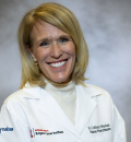 N. Colleen Whelan in clinic coat